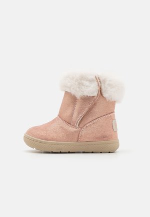 Children's pink suede winter boot with beige rubber sole and white faux fur cuff against white background.