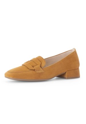 Suede loafers in mustard yellow with a flat block heel, featuring two decorative straps on the front and a pointed toe design.