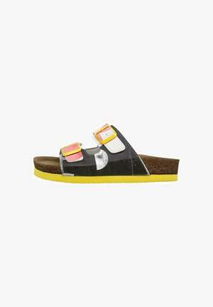 Black slide sandal with yellow sole, white and pink accents, and two bright yellow buckles. Features a textured cork footbed for comfort.