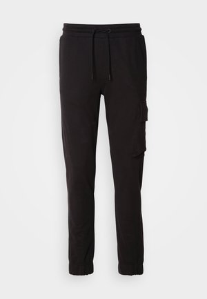 Pantalones jogger negros de mezcla de algodón, con cinturilla elástica con cordón, bolsillos laterales y un bolsillo tipo cargo en el muslo.