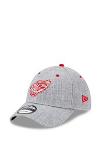 Gray cap made of textured fabric, featuring a red embroidered logo on the front and red accents on the eyelets and button. Curved brim.