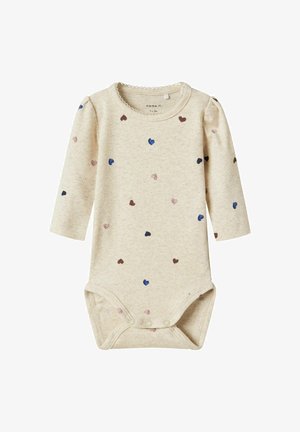 Beige ribbed baby bodysuit with long sleeves and a scalloped neckline. Features small heart patterns in pink, blue, and brown. Snap closure at the bottom.