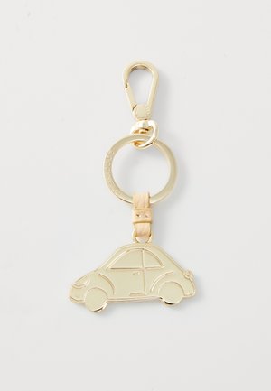 Gold metal car-shaped keychain featuring a smooth surface, outlined windows, and a leather accent with a clip attachment.