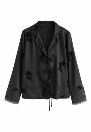 Schwarze Satinkleidbluse mit langen Ärmeln, rosengeblümtem Stoff, Spitzenbesatz an den Manschetten und einer vorderen Bindeschleife. Glatte Textur.