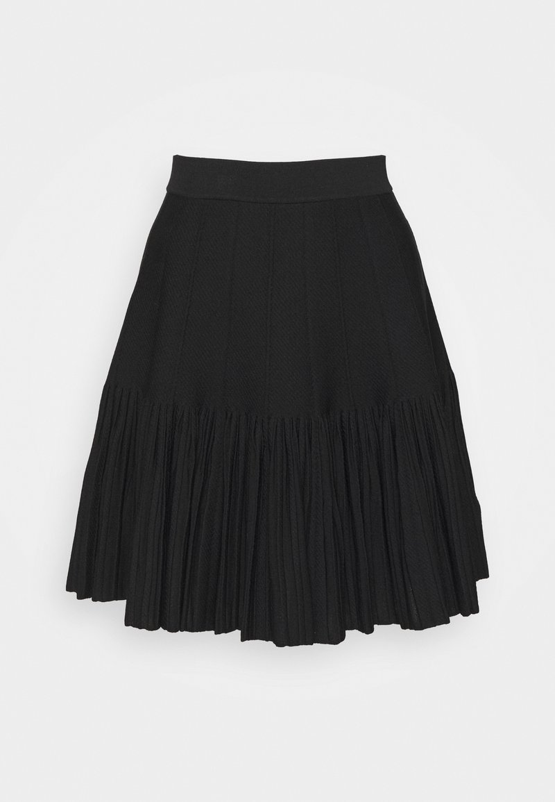 Jupe plissée noire en tissu texturé, dotée d'une taille cintrée et d'une partie inférieure fluide avec des plis verticaux.