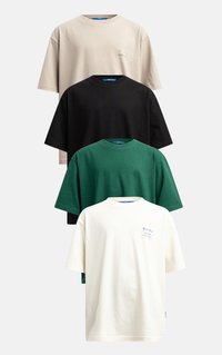 Four short-sleeve cotton t-shirts in beige, black, green, and white, featuring minimal branding and a relaxed fit with a round neckline.