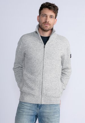 Gray zip-up sweater with textured diagonal knit design and ribbed hem. Features high collar and side pockets. Worn over a black shirt.