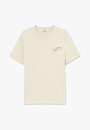 Beige cotton t-shirt featuring a round neck, short sleeves, and a purple printed logo on the left chest area. Smooth texture.