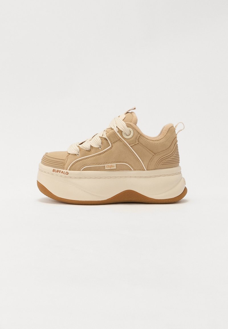 Beige platform sneaker with thick white sole, chunky white laces, suede texture, and "Buffalo" branding on the side and sole front.