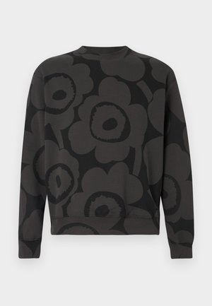 Must lillemustriga pusa ümmarguse kaeluse, pikkade varrukate ja soonikkoes äärega. Valmistatud pehmest, tekstuurse kangaga.