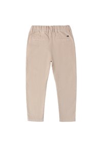 Beige corduroy broek met een elastische tailleband, voorzien van twee achterzakken en een slim fit ontwerp. De stof heeft een gestructureerd geribbeld oppervlak.