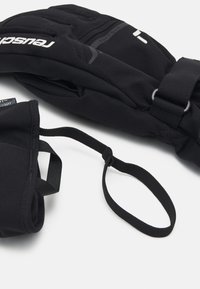 Gants en softshell noirs avec une texture lisse, dotés d'une sangle et d'un détail de logo. La conception ergonomique permet un mouvement flexible.