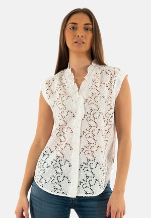 Witte blouse met ingewikkelde uitgesneden bloemembroidery, scalloped kraag en knoopsluiting. Mouwloos ontwerp en lichtgewicht stof.