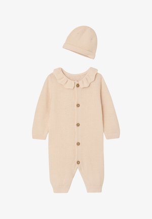 Pale pink knitted baby onesie with ruffled collar, front button closure, and matching beanie hat, featuring a textured fabric.