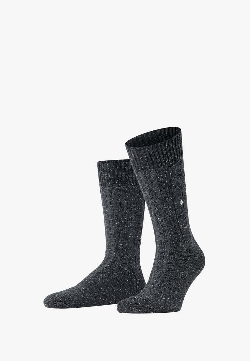 Calze a coste grigio scuro con texture marmorata e tallone rinforzato. Il bordo è elasticizzato per una vestibilità comoda, con un discreto dettaglio del logo.
