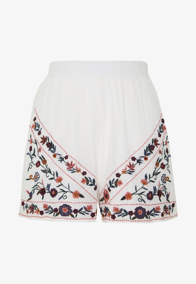 Shorts blancs avec une ceinture élastique ornée d'une broderie florale colorée en rose, orange et bleu le long des coutures diagonales.
