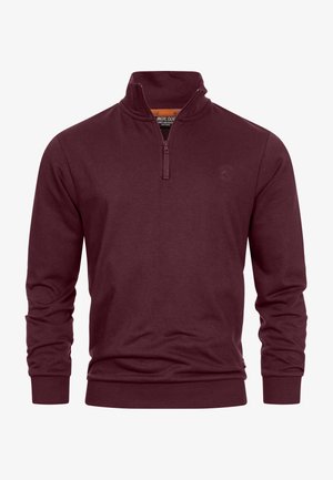 Burgundy pullover sweatshirt with a quarter-zip collar, ribbed cuffs, and hem. Made from a smooth, soft fabric with a subtle texture.