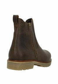 Bruine leren enkelboot met zijrits, trekkus en dikke beige rubberen zool met profielpatroon.
