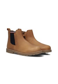 Stivali Chelsea in pelle color cuoio con pannelli laterali elasticizzati, linguette per facilitare la calzata e punte rotonde. La suola in gomma testurizzata presenta piccole punte per migliorare la trazione.