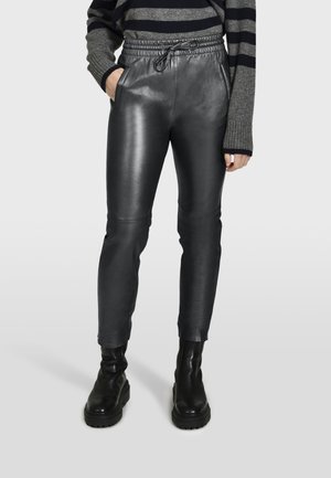 GIFT METAL - Leather trousers - black