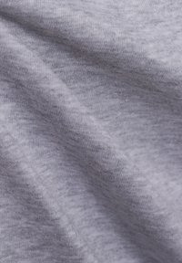 Gray cotton fabric with a smooth texture, showing natural stretch and subtle variations in shade, suitable for garments or textiles.