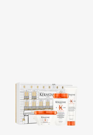 Kérastase Haarpflege-Geschenkset, bestehend aus drei Produkten: einer weißen Schüssel, orangen Kappen und einer Tube, alles in einer dekorativen illustrierten Box.