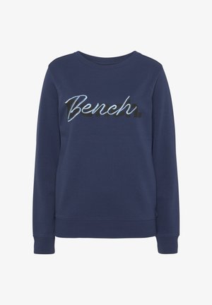 Navy blue sweatshirt made of soft fabric with ribbed cuffs and hem. Features "Bench." logo in stylized black and light blue lettering.