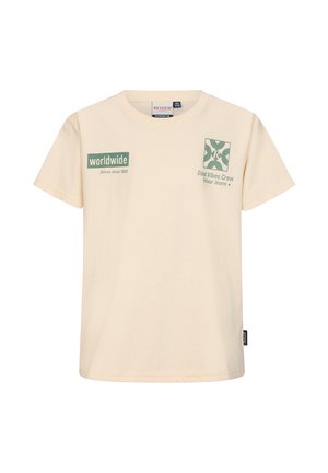 Beiges T-Shirt mit kurzen Ärmeln und grünem Aufdruck "worldwide Driven since 1969" sowie "Good Vibes Crew Retour Jeans" auf der Brust.