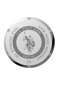 Cadran de montre en acier inoxydable rond avec un graphique de joueur de polo gravé. Le texte comprend "U.S. Polo Assn." et "Résistant à l'eau jusqu'à 3 ATM."