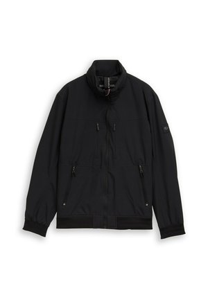 Schwarze Jacke mit Reißverschluss und Stehkragen, zwei vertikale Brusttaschen, zwei seitliche Reißverschlusstaschen und elastische Bündchen an den langen Ärmeln.