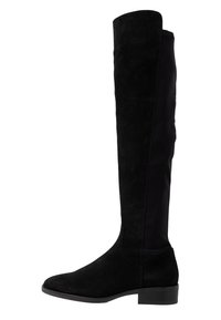 Bota negra sobre la rodilla con frontal de gamuza y parte trasera de elastano, con punta redonda y tacón bajo en bloque. Textura suave en toda la bota.