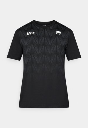 Black short-sleeve t-shirt featuring a geometric pattern, a round neck, and UFC logo on the front left side. Smooth fabric texture.
