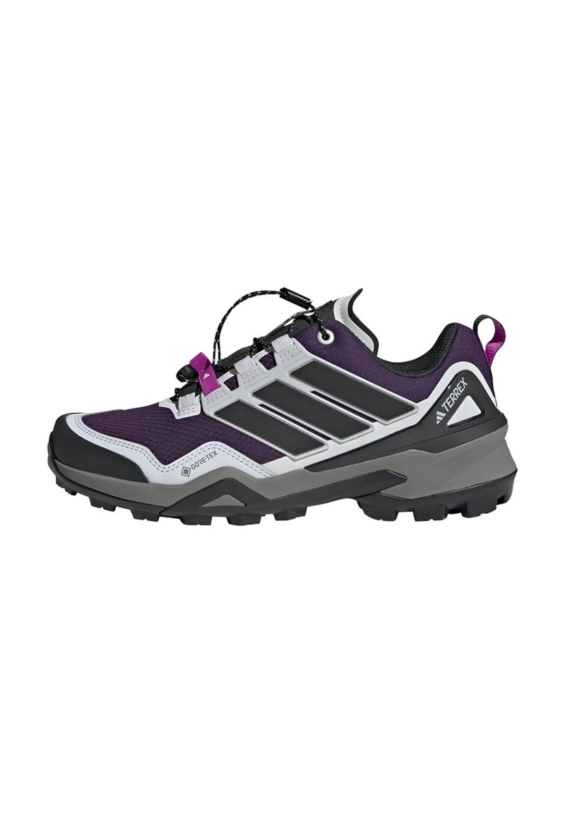 Lila und graue Trail-Schuh mit strukturiertem Obermaterial, schwarzen Akzenten, einer Gummisohle und einem Schnell-Schnürsystem für einen sicheren Sitz.