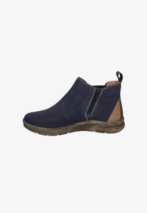 Dunkelblauer Wildleder-Ankle-Boot mit seitlichem Reißverschluss, tanfarbiger Akzent an der Ferse und einer strukturierten Gummisohle. Mit sichtbaren Steppnähten.