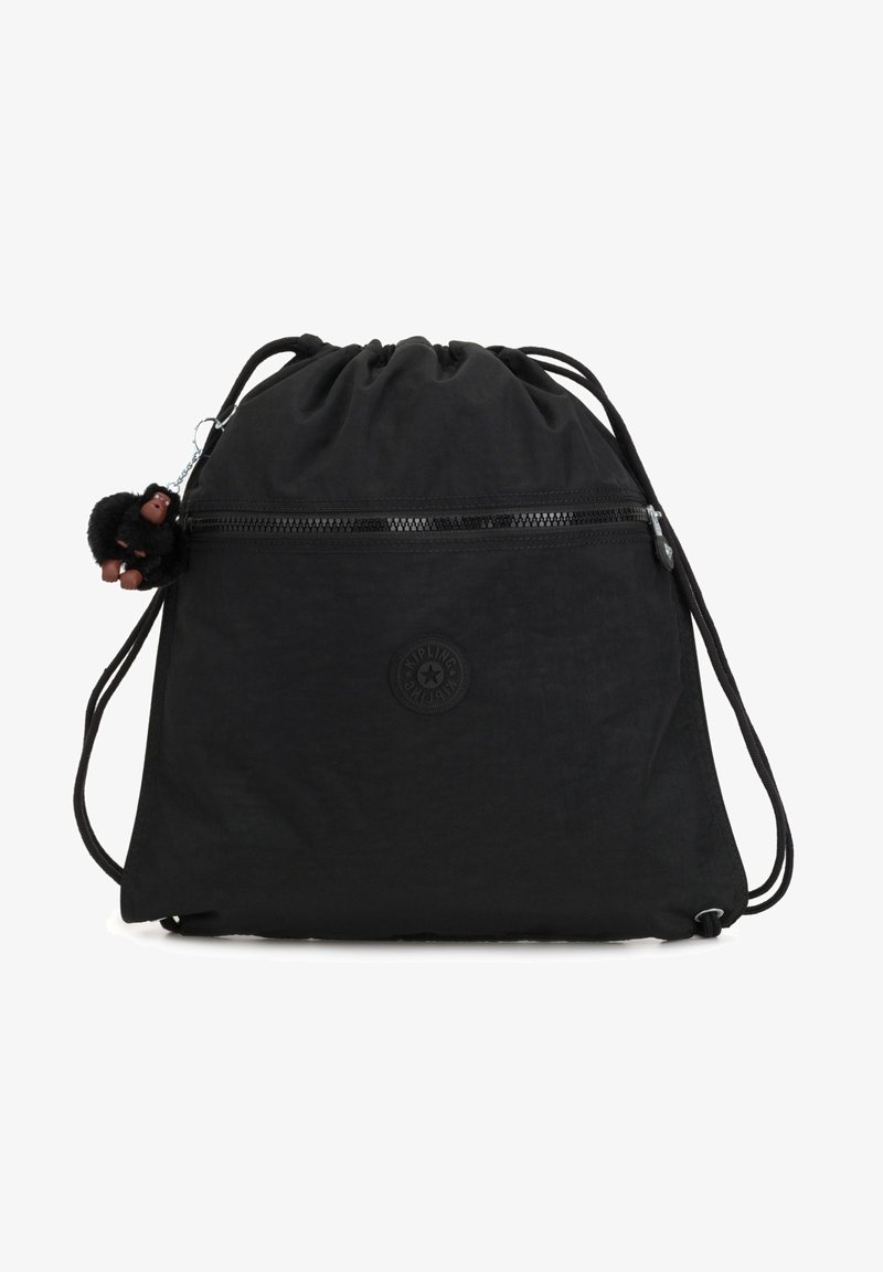 Sac à dos noir à cordon avec poche zippée à l'avant et petit porte-clés singe noir attaché sur fond blanc.