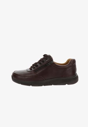 Sneaker casual in pelle marrone scuro con suola nera, chiusura frontale con lacci e cerniera laterale per un facile indosso.