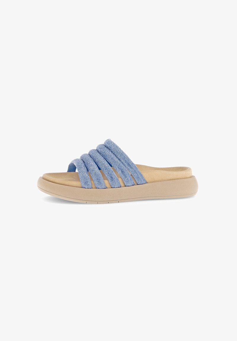 Blue denim slide sandals with four wide straps, tan cushioned footbed, and a light beige rubber sole. Smooth texture, flexible design.
