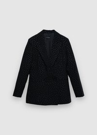 Blazer noir à pois blancs, design structuré, col à revers crantés, manches longues, poches avant, fermeture double bouton.