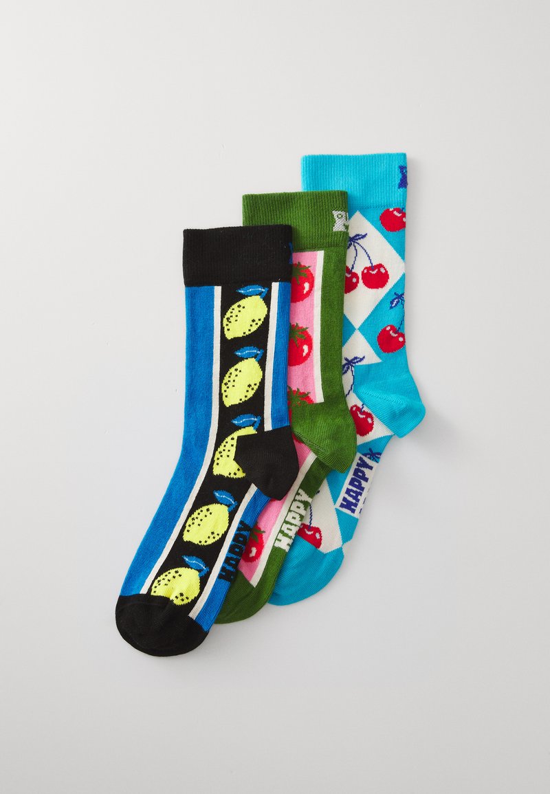 Four pairs of cotton socks featuring colorful patterns: lemons on blue, green solid, cherries on light blue and pink checkered designs.