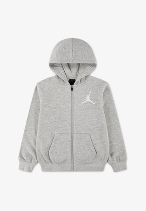 Sweat à capuche zippé gris clair avec poches avant, capuche et logo Jumpman blanc sur la poitrine gauche. Aucune personne n'est présente.