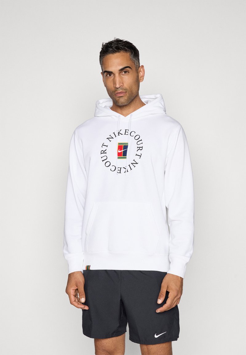Bela kapuco iz kombinacije bombaža, s krožnim logotipom NikeCourt na sprednji strani, sprednjim kengurujskim žepom in rebrastimi manšetami.