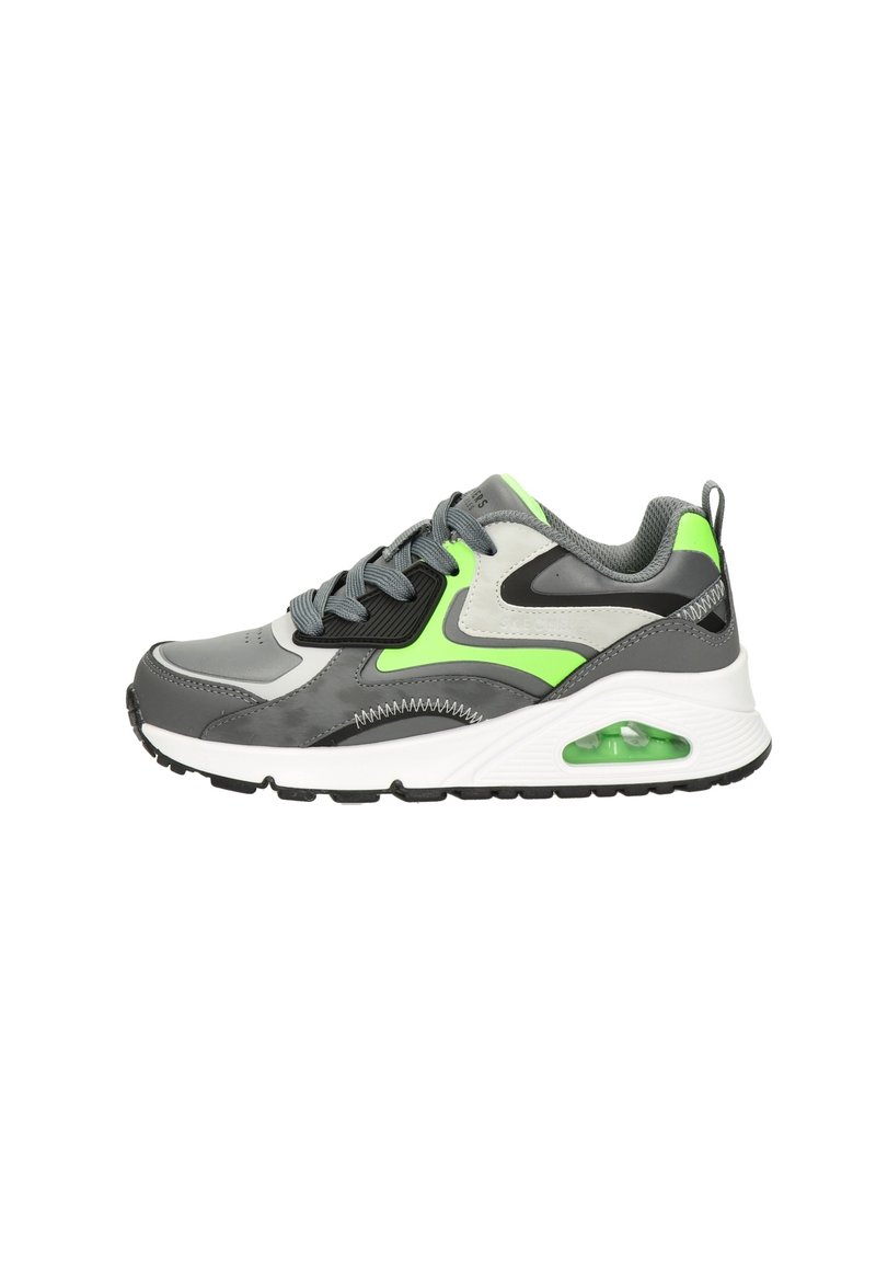 Gray athletic shoe featuring a neon green accent, textured overlays, a cushioned sole with a visible air unit, and black rubber outsole.