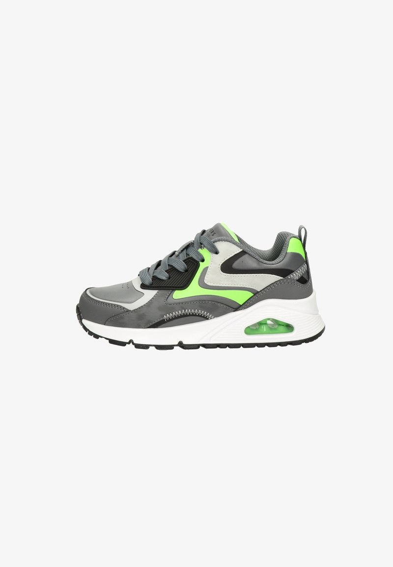 Gray athletic shoe featuring a neon green accent, textured overlays, a cushioned sole with a visible air unit, and black rubber outsole.