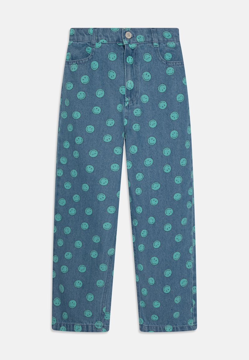 Denim jeans with a relaxed fit, featuring a blue base and a repeating pattern of green smiley faces throughout. Button closure at waist.