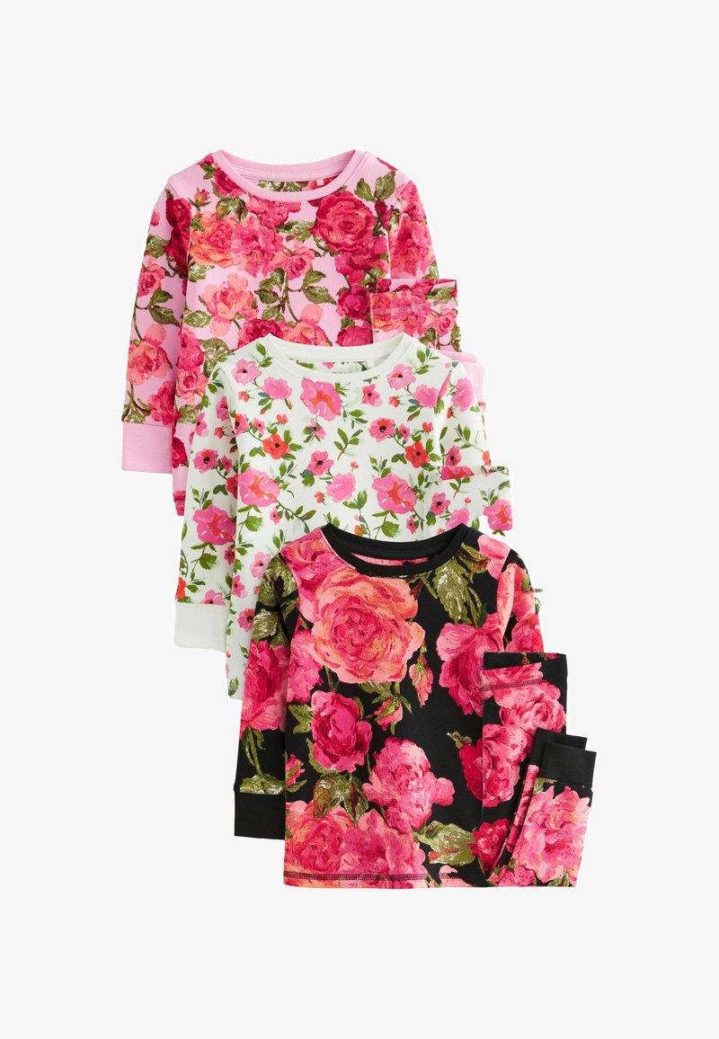 Tre langærmede toppe med blomsterprint: lyserøde roser på en lyserød baggrund, hvid med forskellige blomster, og sort med store lyserøde roser.