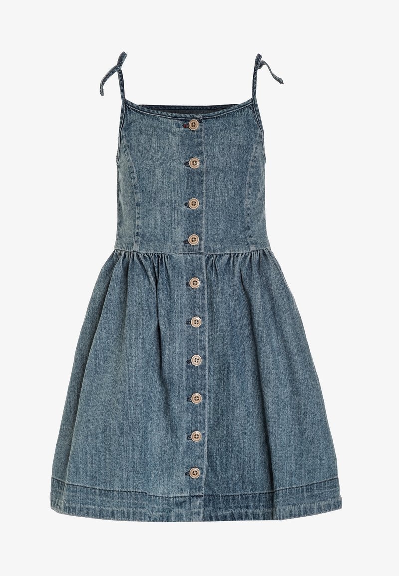 Abito in denim con spalline sottili regolabili, corpetto aderente, gonna svasata e chiusura frontale con bottone in legno. Colore azzurro chiaro con lieve texture.