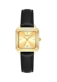 Montre carrée dorée avec un cadran ensoleillé, bracelet en cuir noir, deux marqueurs d'heure métalliques et une petite couronne sur le côté droit.