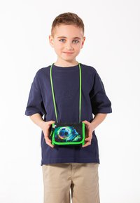 Small black and green crossbody bag with a soccer ball graphic, zip closure, and adjustable green strap. Flat rectangular design.