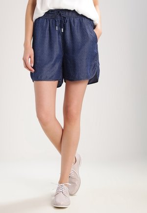 Marineblaue Shorts mit weißen Polka-Dots, gerafftem Bund mit Kordelzug, Seitentaschen und lockerer Passform. Lässiger Stil mit glatter Textur.