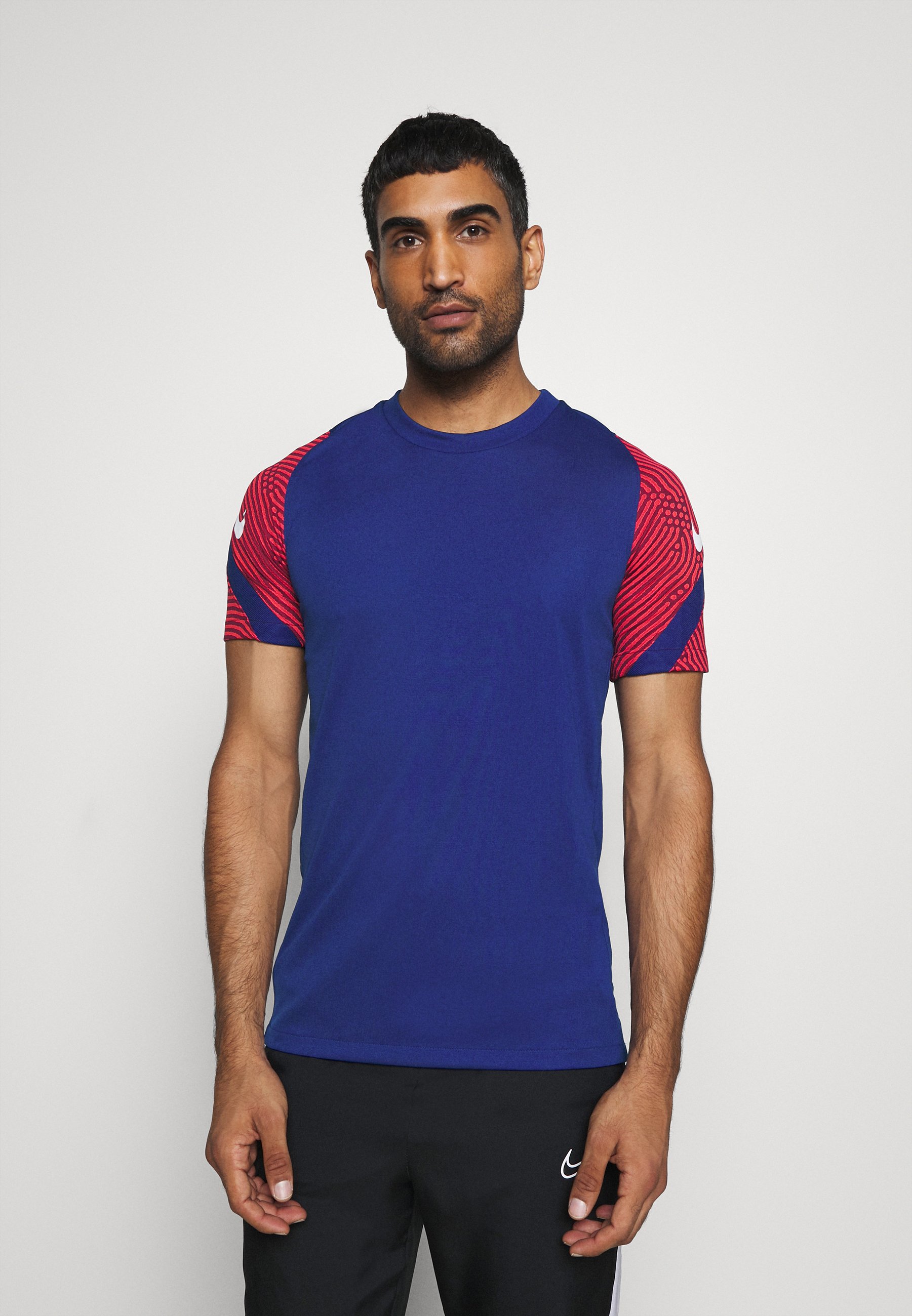 white and royal blue nike shirt